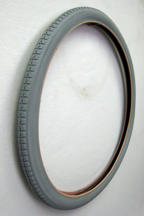 24x1-3/4 Pneumatic Wheelchair Tire with black rim and street tread, designed for Everest & Jennings wheelchair models. Non-marking gray rubber, tube sold separately.