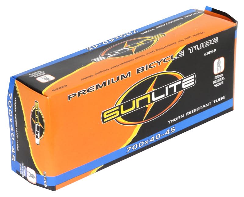 Box labeled Sunlite containing a 700x40-45 Heavy Duty Thorn Resistant Bicycle Inner Tube with 32mm Presta Valve, visible packaging displaying product details, ideal for replacing old bike inner tubes.
