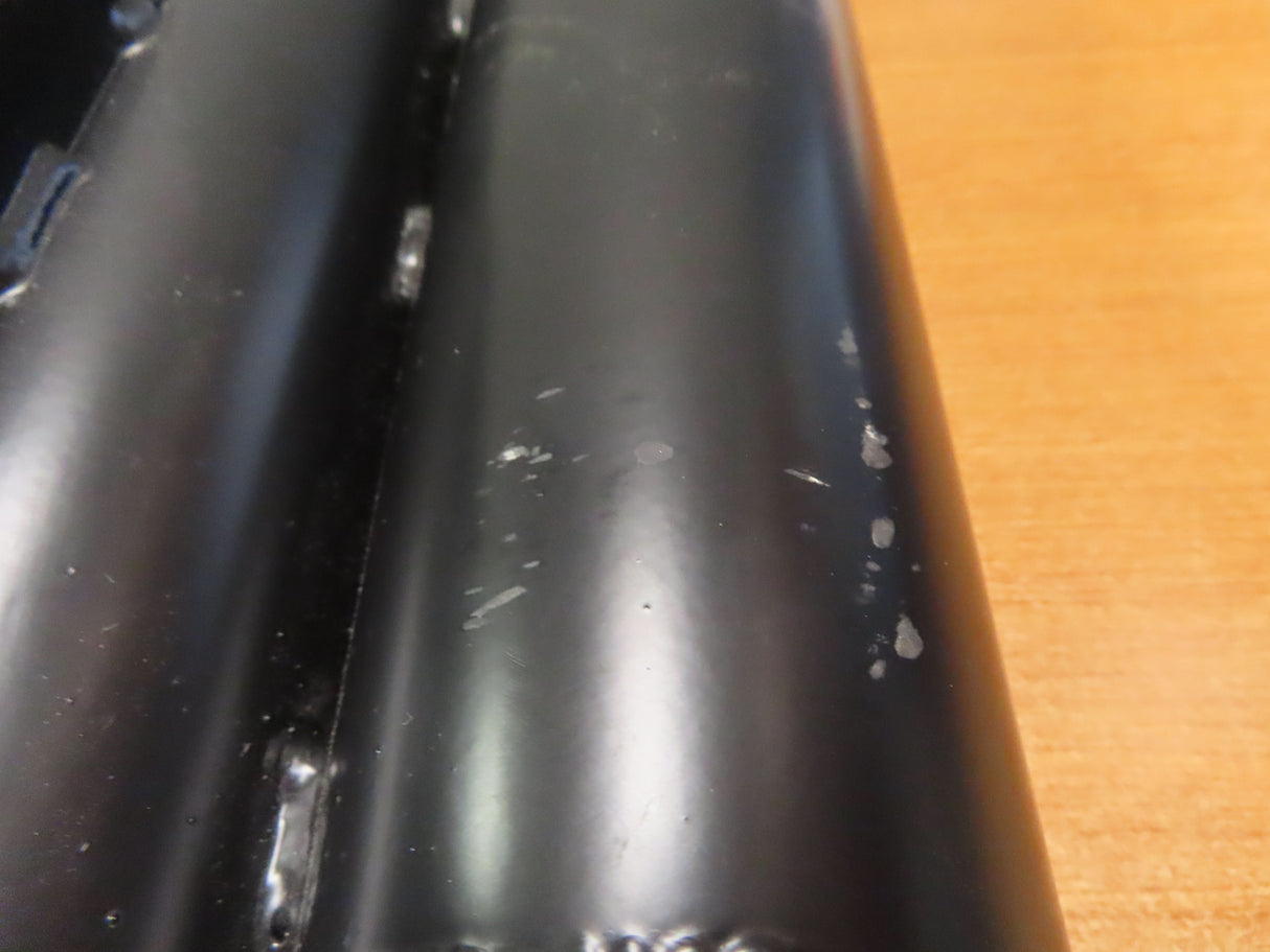 Crutch Holder for Pride Mobility Scooters (Blemished) featuring a black metal tube with white spots, designed to securely attach crutches to mobility scooters.