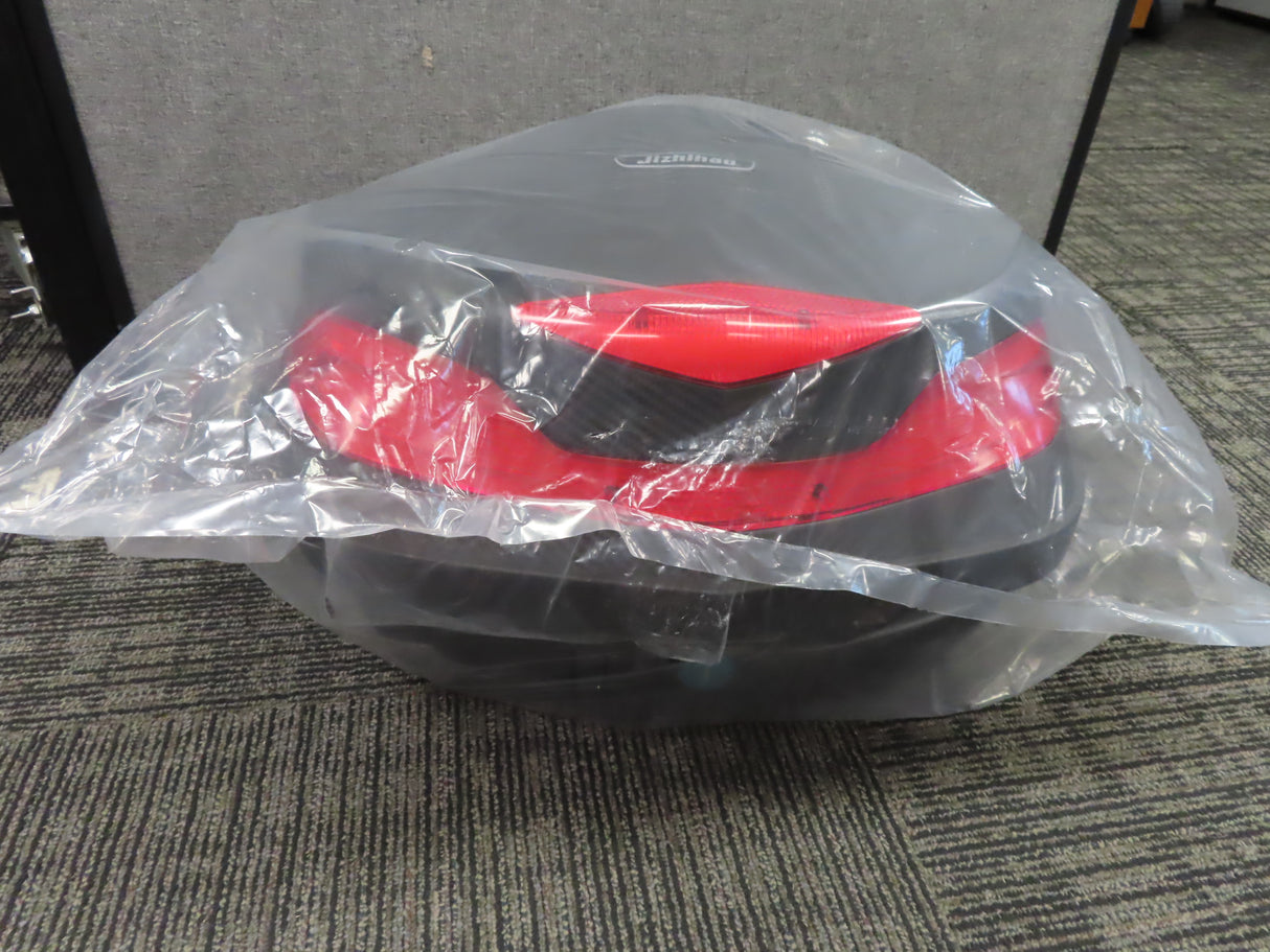 Deluxe Top Case Scooter Trunk (X-Large) (Blemished) in a plastic bag, showcasing its sturdy build and ample storage, ideal for securely carrying items on a scooter.