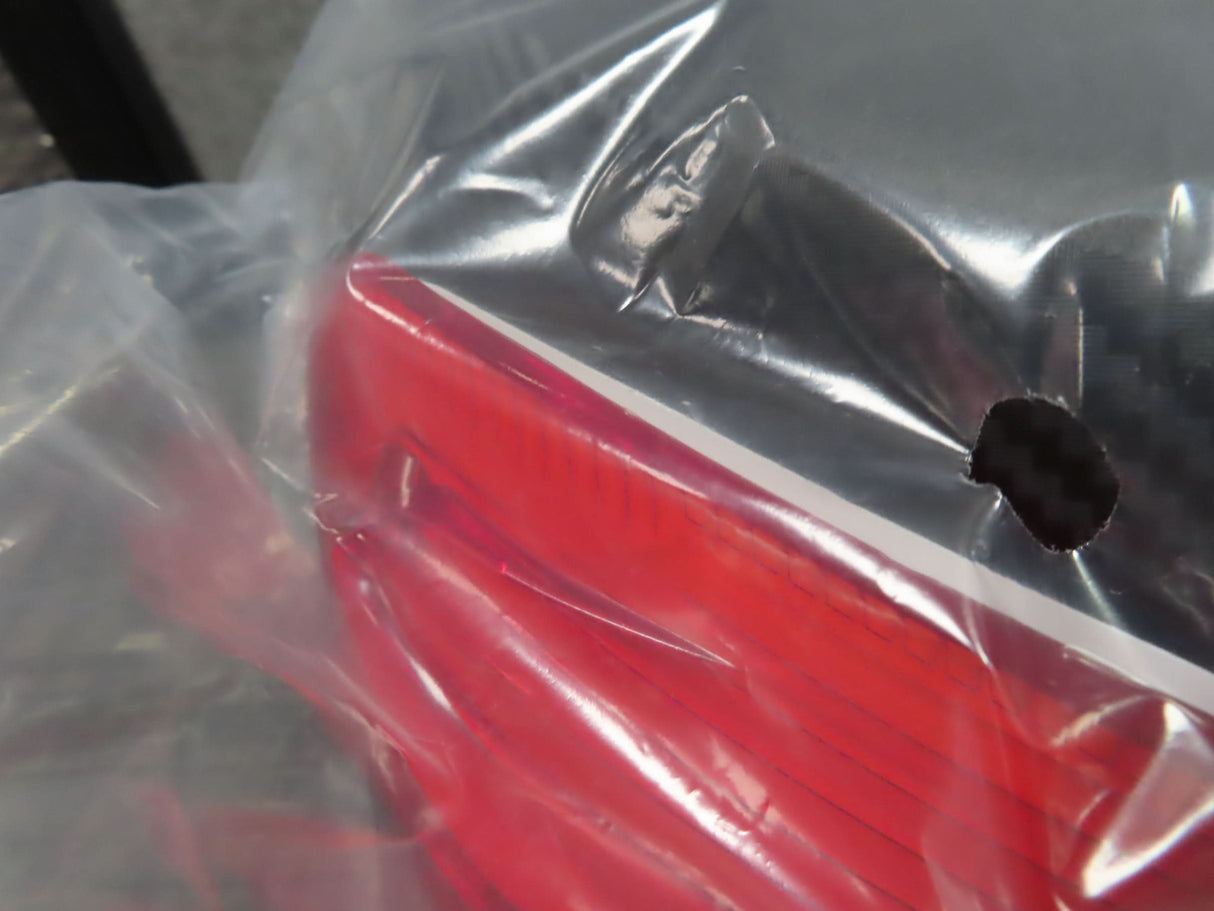 Deluxe Top Case Scooter Trunk (X-Large) (Blemished) with a visible hole in the plastic bag, showcasing its large capacity and universal mounting platform.