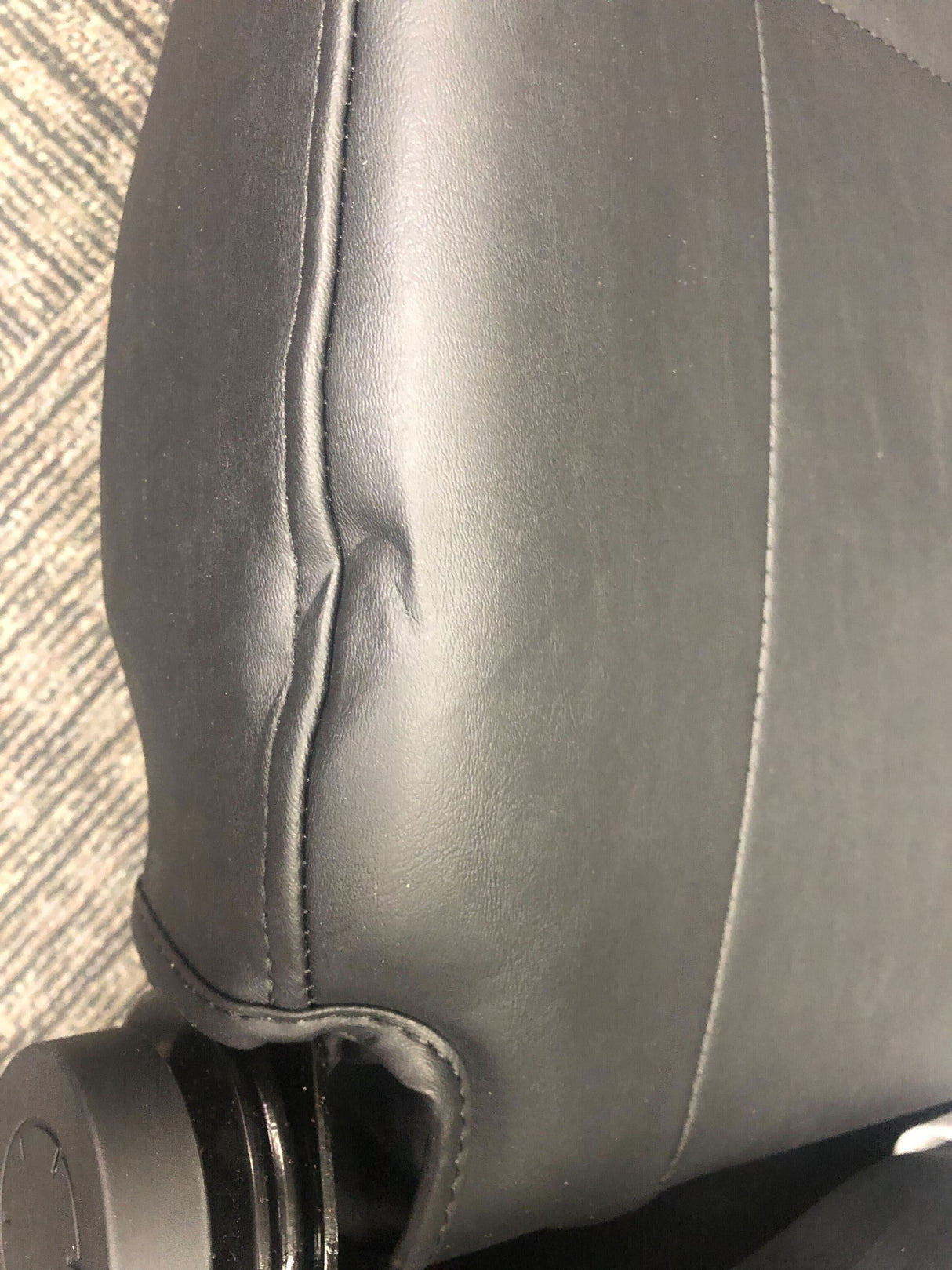 20x18-20 Hi-Back Black Vinyl Limited Recline Comfort Seat Assembly for Jazzy & Quantum Power Chairs, featuring armrests, headrest, seat plate, and lap belt, shown in close-up of black leather upholstery.