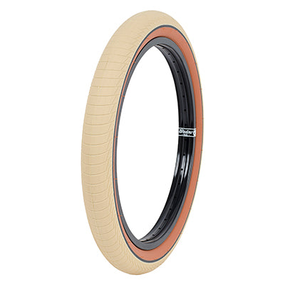20x2.3 Cream Serpent Bicycle Tire, featuring a micro knurled smooth tread with horizontal lined section, ideal for close course park and ramp riding.