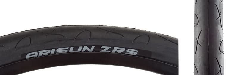 Close-up of the 26x1.5 ZRS Wire/30 Bicycle Tire, showcasing its smooth, fast-rolling center and grooved shoulders designed for enhanced cornering traction.