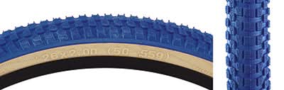 Close-up of a 26x2.0 Blue/Tan Cub Bicycle Tire, showcasing its classic BMX street tread pattern, a result of a collaboration between Vee Tire and SE Bikes.