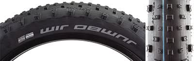 Close-up of a 26x4.8 Jumbo Jim Evolution SnakeSkin Bicycle Tire, showing its widely spaced knobs, aggressive corner lugs, and robust tread, designed for deep soil and rough terrain.