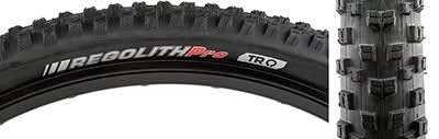 Close-up of the 29x2.2 Regolith Pro SCT Bicycle Tire, showcasing its alternating double block tread center and chain corner lugs, designed for versatile off-road handling and traction.
