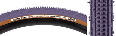 Close-up of a 700x38 Purple/Brown Gravel King SK Bicycle Tire showing five rows of square knobs and double rows of continuous ridges, designed for smooth rolling and excellent grip on rough or gravel roads.