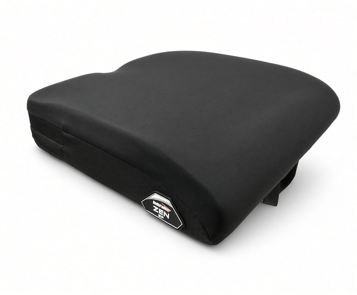 A black contoured Stealth ZEN SP Seat Cushion for Jazzy & Quantum Power Chairs with a small silver and black Zen SP brand badge on the front side, shown on a clean white background.