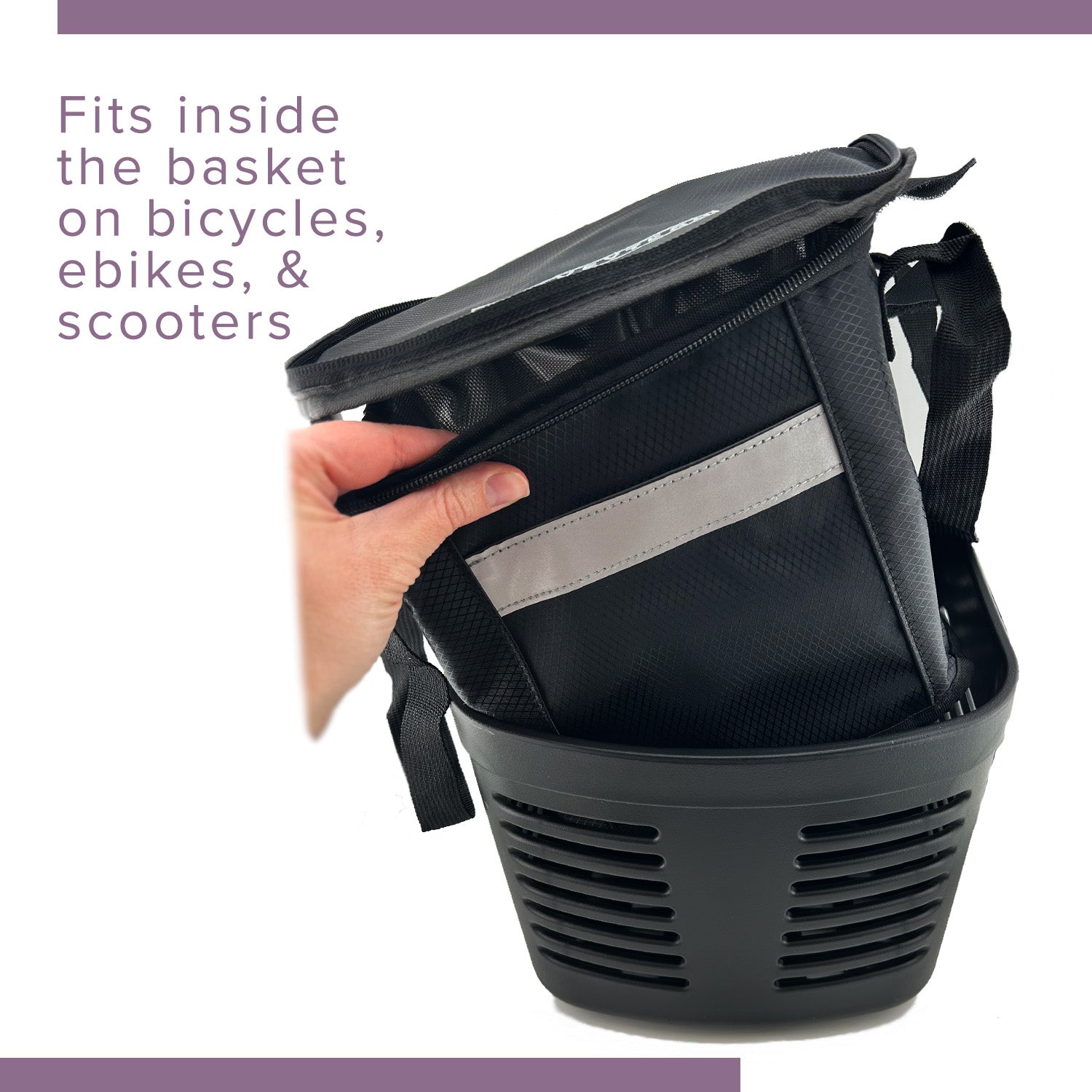 Hand holding the Insulated Front Basket Bag for Mobility Scooters, featuring a zippered main compartment and durable ripstop polyester construction.