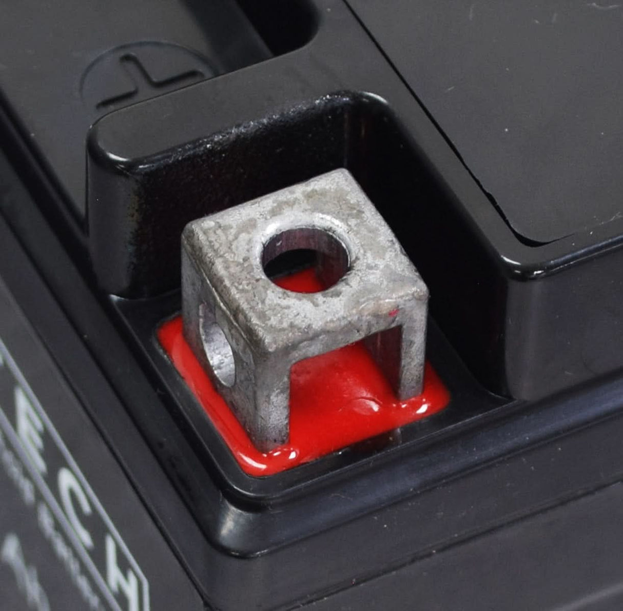 Close-up of a 12 Volt YTX4LB Replacement Sealed AGM Go-Kart Battery, showcasing its maintenance-free design and metal terminals.