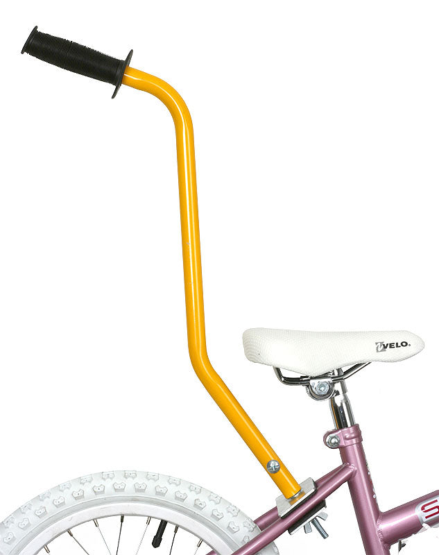 Close-up of a yellow and purple bike featuring the Bike Trainer Handle, a mounted handle designed for parents to assist children with learning to ride, compatible with any kids' bike.