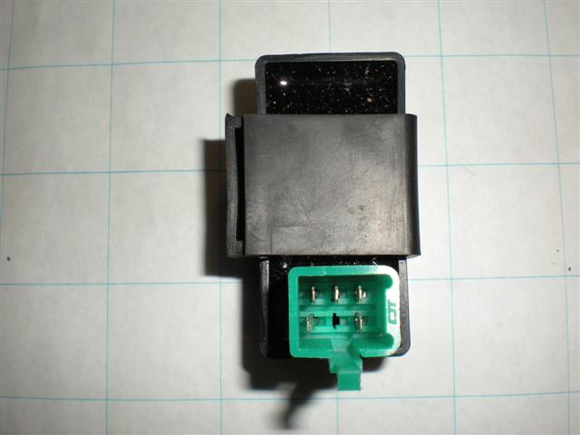 CDI Module (Ignitor) for Baja Dirt Runner 49 (DR49) & Dirt Runner 70 (DR70) with a 5 pin square connector, featuring a black and green electronic device with visible metal pins.