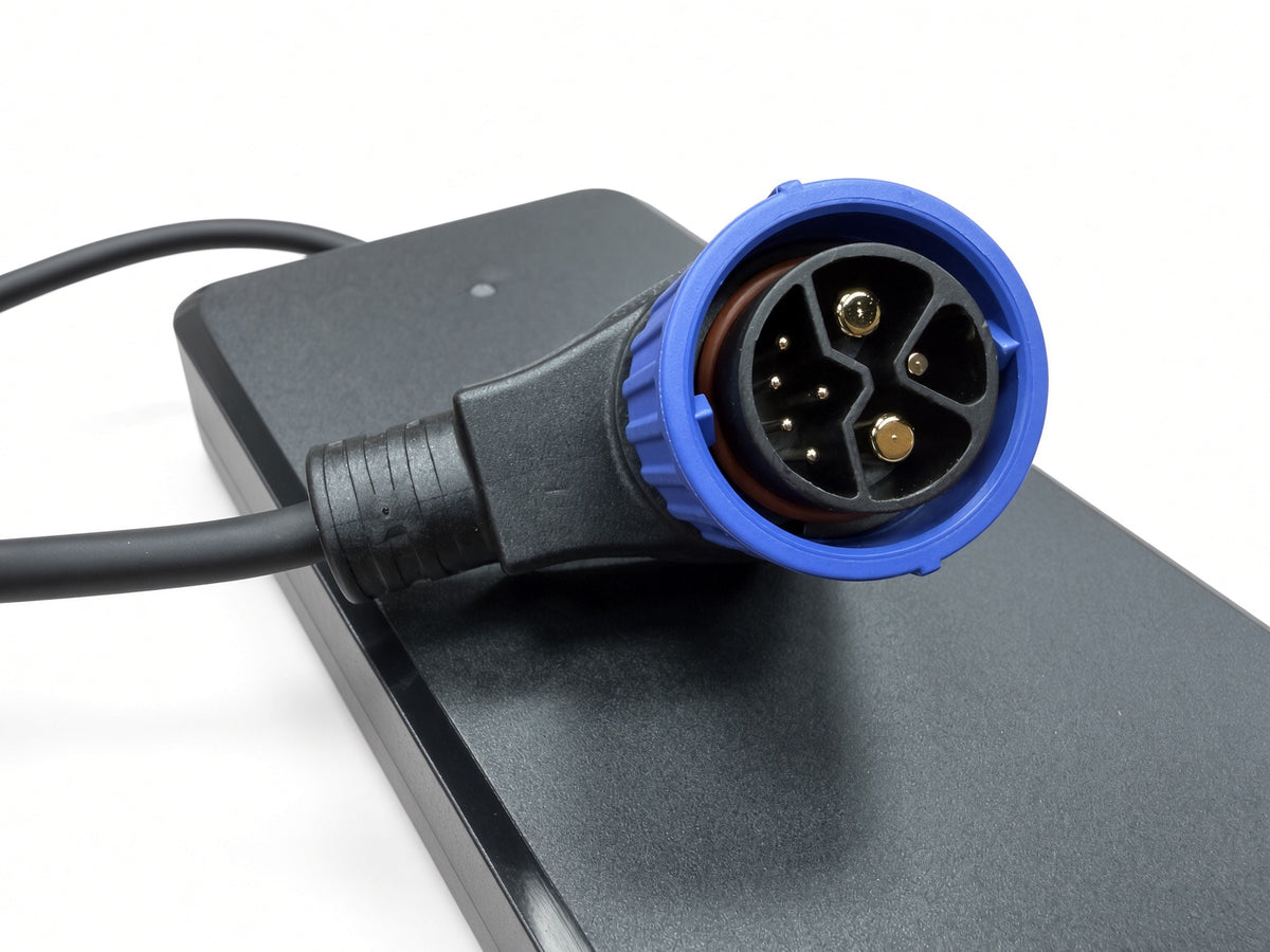 Close-up of the blue 8-pin connector on the Coleman EVB200 60 Volt battery charger