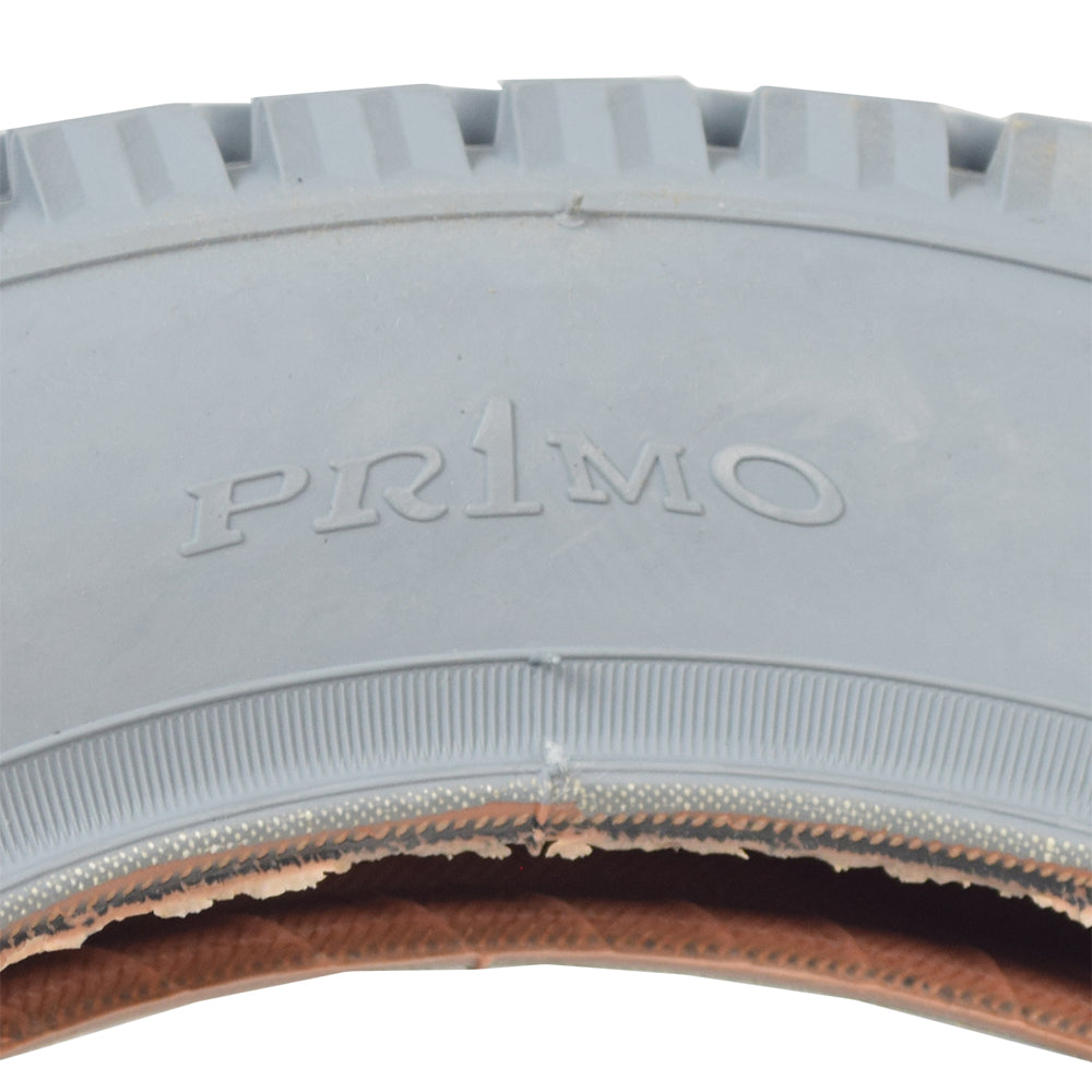 Close-up of the 12-1/2x2-1/4 pneumatic mobility tire with C628 Power Express tread for Invacare power chairs, highlighting its detailed rubber texture and tread pattern.