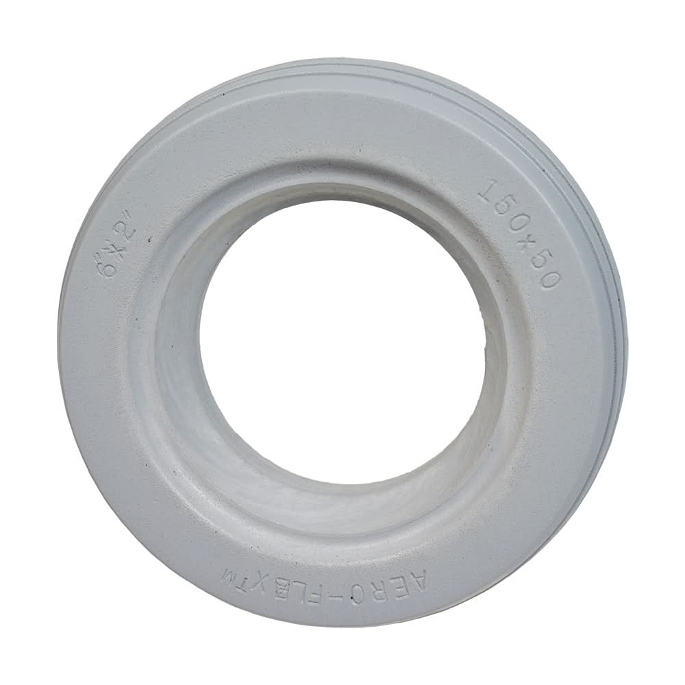 6x2 (150x50) AeroFlex Solid Urethane Mobility Tire with 4-Rib Tread, featuring a white circular design with a central hole, suitable for wheelchairs, providing flat-free dependability and enhanced traction.