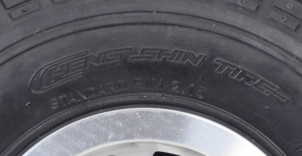 Close-up of the 3.00-4 (10x3, 260x85) Solid Front Wheel Assembly for the Drive Daytona 3 GT Mobility Scooter, highlighting the robust tread pattern and durable synthetic rubber construction.