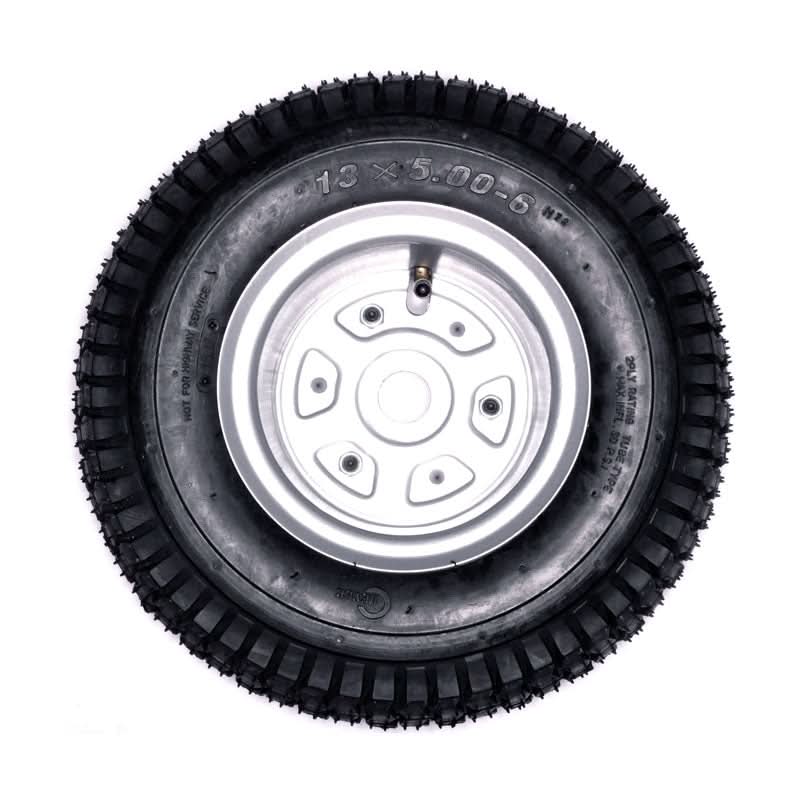 Razor Dirt Quad Rear Wheel Assembly (Versions 1 - 18), showcasing a black tire with a silver rim, designed for durability and compatibility with specified Razor Dirt Quad models.