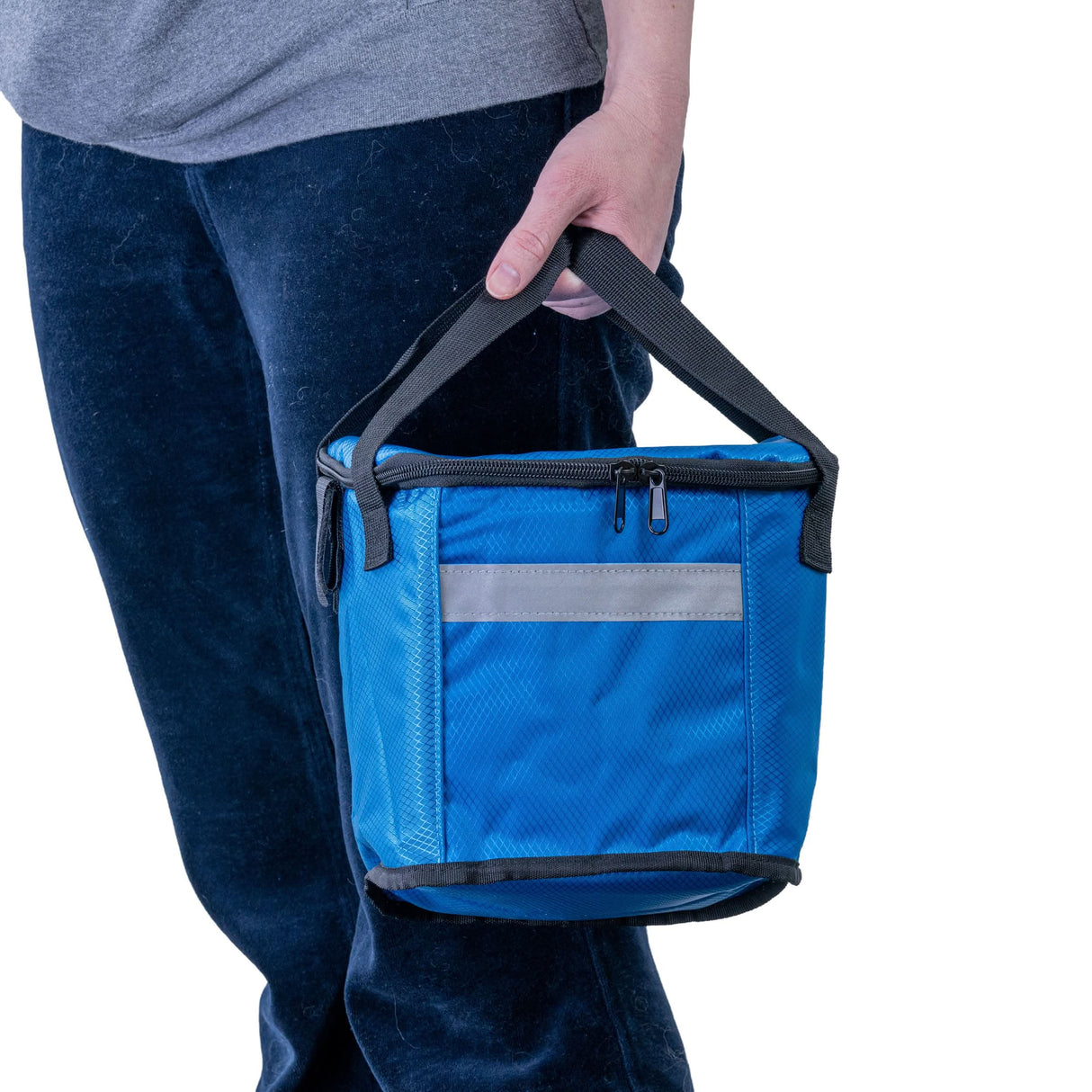 Person holding the AlveyTech Insulated Front Basket Bag for Mobility Scooters, showcasing its ample storage space, durable ripstop polyester construction, and zippered main compartment ideal for carrying various essentials discreetly.