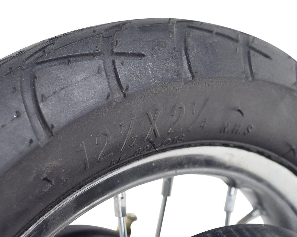 Close-up of the Rear Wheel Assembly with Wire Spoke Rim for the Razor Pocket Mod (Versions 13-30), showcasing the tire tread, wire spokes, and part of the rim.