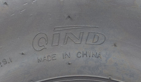 Close-up of a 19x7.00-8 Tire with QD116 V-Tread for Baja Mini Bikes MB165 & MB200, ATVs, & Go Karts, showcasing its aggressive V-tread pattern for optimal traction.