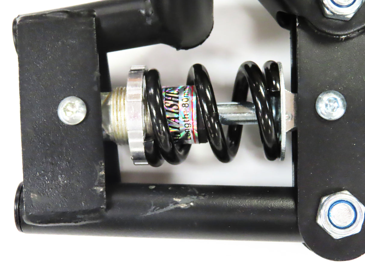 Deluxe Hoverboard Go-Kart Attachment Kit with Large Front Wheel & Suspension (Blemished), showing black metal frame, spring, front wheel, and handlebar levers. Visible scratches and scrapes on the black enamel finish.