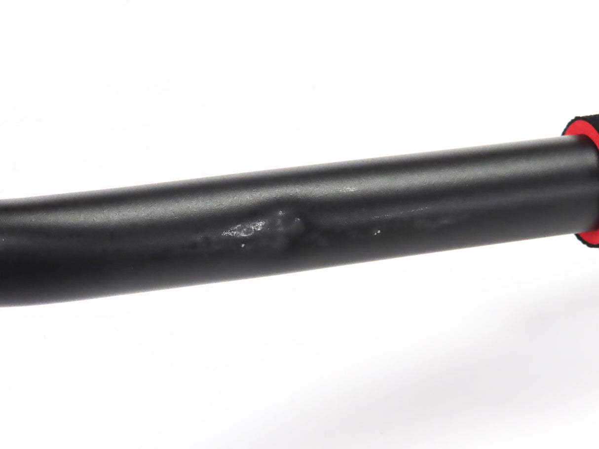 Close-up of the Deluxe Hoverboard Go-Kart Attachment Kit with Large Front Wheel & Suspension (Blemished), showcasing the black pipe and visible scratches on the black enamel finish and plastic seat.