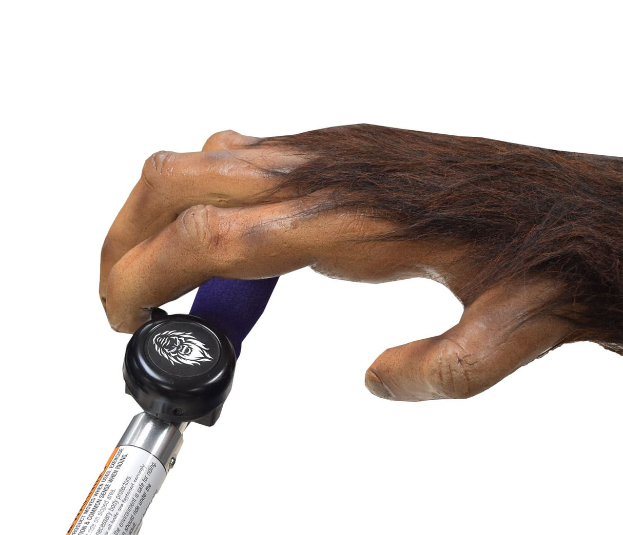 Hand holding the Sasquatch Bicycle and Scooter Bell - Monster Scooter Parts Exclusive!, highlighting its black handle and compact design, perfect for any 7/8 handlebar.