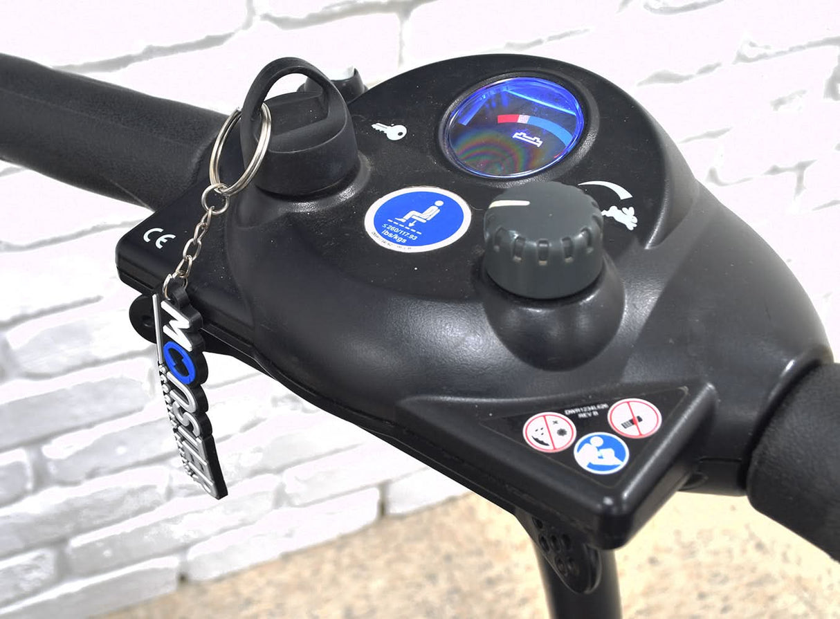 Deluxe Easy Pull Key for Vive Mobility Scooters attached to a bike handlebar, featuring a round molded black plastic knob with an easy pull finger ring for easy handling.