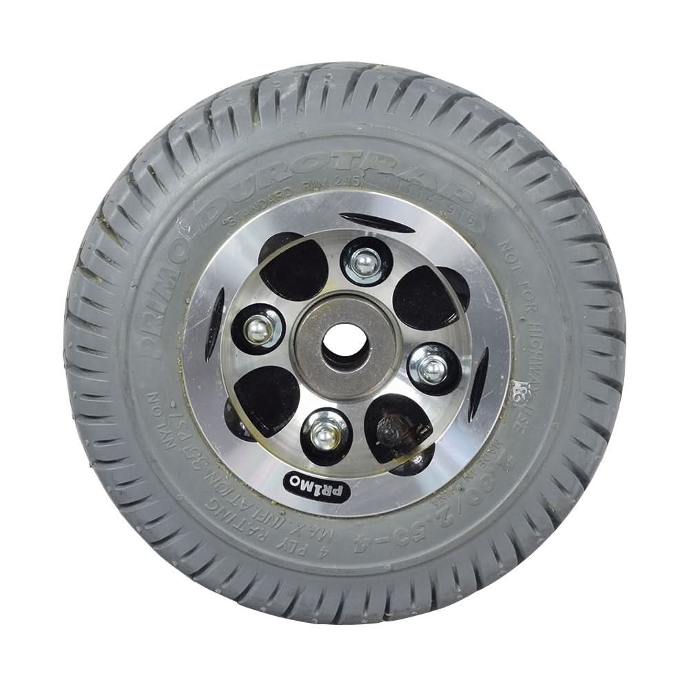 Flat-Free Rear Wheel Assembly for Pacesaver Plus III Scooters, featuring a robust tire with Primo Durotrap tread and a durable metal rim, designed for reliable use in various environments.