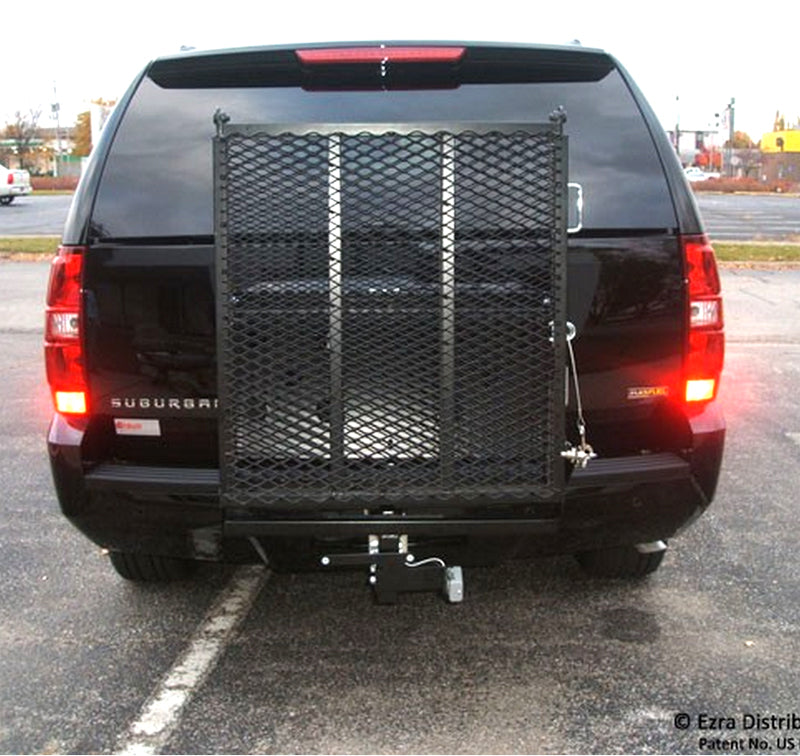 Safety Ramp for Mobility Scooters: A black SUV's rear with an attached, folded mobility scooter ramp in a durable powder coat finish, showcasing its sturdy construction and vehicle-mounted placement.