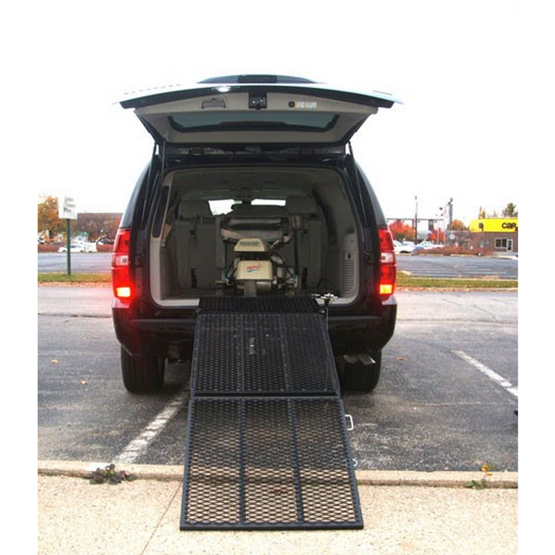 Safety Ramp for Mobility Scooters shown installed in a van, featuring a sturdy black metal platform with holes, designed for easy vehicle access.