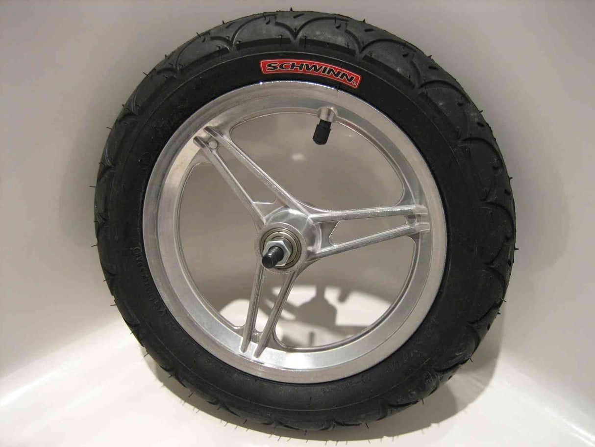 Schwinn 12-1/2 x 2-1/4 Complete Front Wheel Assembly with three-spoke rim, tire, tube, bearings, and axle, featuring a close-up of the spoked wheel and hub.