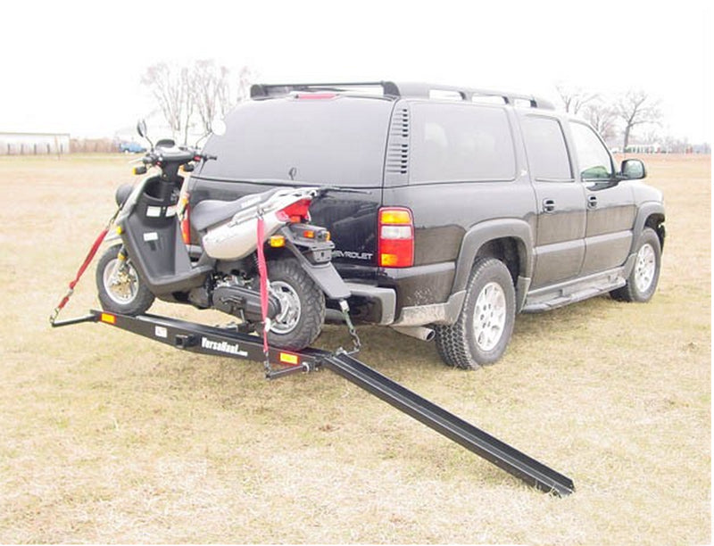 Single Scooter Carrier with Ramp: A sturdy motorcycle parked on a trailer with a ramp, showcasing its durable construction and practical design for easy transport.