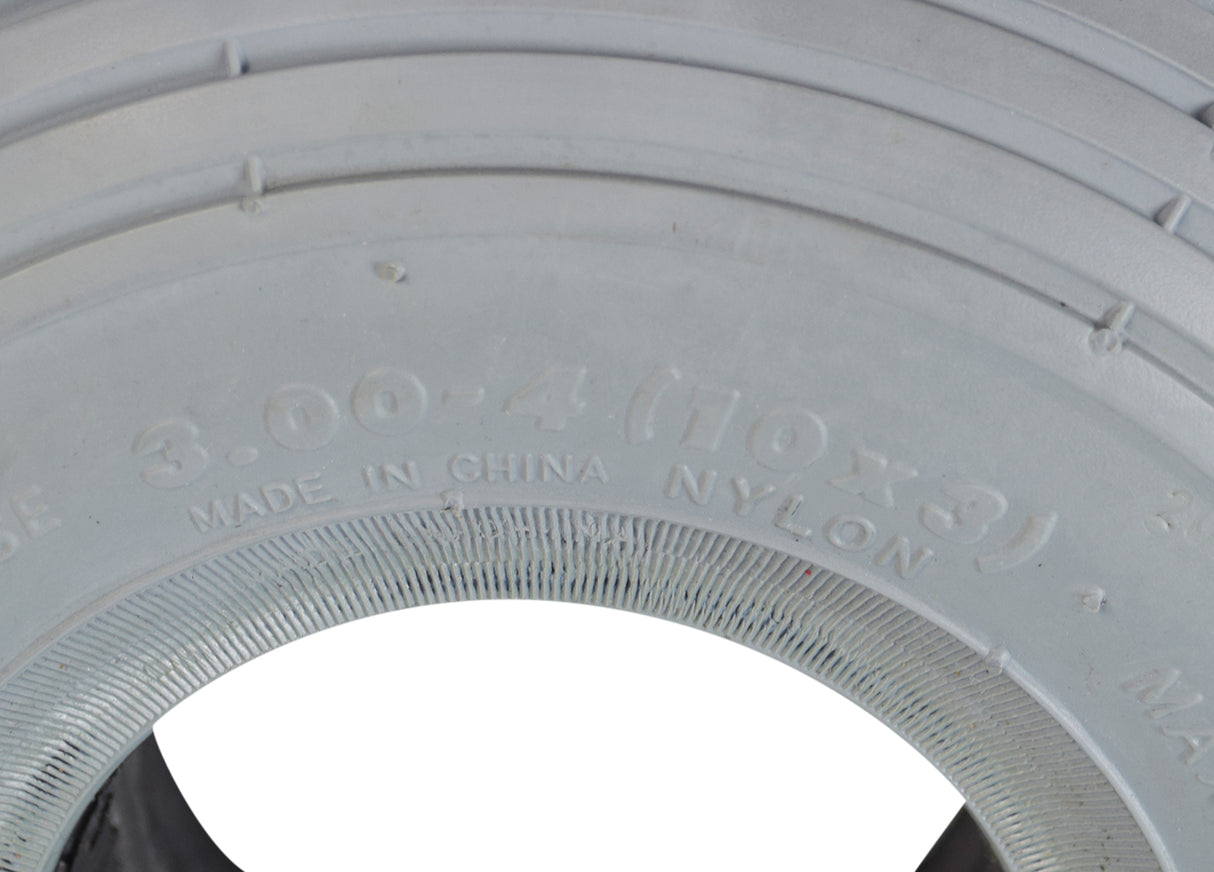 Close-up of a 3.00-4 (10x3, 260X85) foam-filled mobility tire with C170G Spirit ribbed tread, ideal for mobility scooters and power chairs.