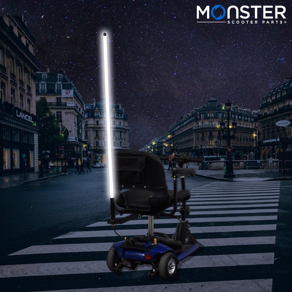 48 Multicolor LED Whip Light & Utility Cart Hitch Extender Kit for Mobility Scooters: a scooter with a vibrant LED pole light attached to a hitch extender, illuminating the street.