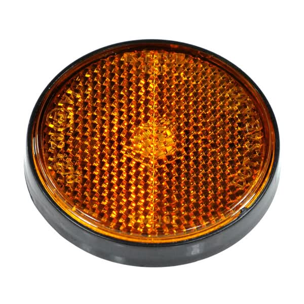 Close-up of the Dark Amber Front Side Reflector for the Baja Mini Bike MB165 & MB200, showcasing its textured surface and reflective quality, essential for enhancing visibility and safety on various vehicles.