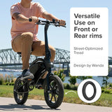 12-1/2x2-1/4 Pneumatic Tire for the Jetson® Bolt Folding Electric Bicycle shown on a bike being ridden outdoors, highlighting its directional tread pattern designed for improved speed and maneuverability.