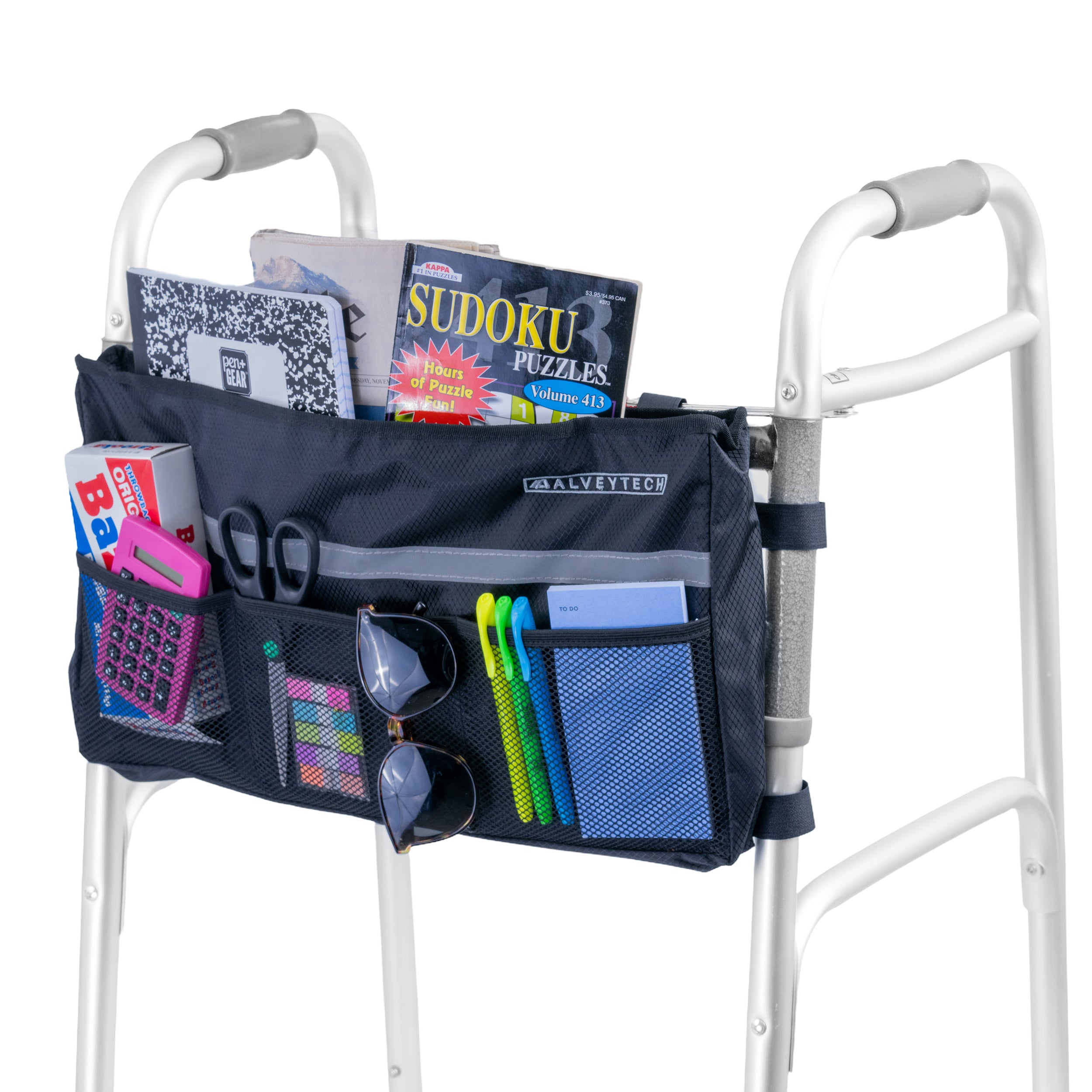 Deluxe Universal Walker/Rollator Bag attached to a walker, filled with books, a calculator, and other items, featuring multiple mesh pockets and a large central compartment for convenient storage.