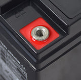 Close-up of a 12 Volt AGM Battery for Pride Backpacker Series Vehicle Lifts, showcasing the top terminals and label, emphasizing its high quality and reliability for mobility scooter and power chair lifts.