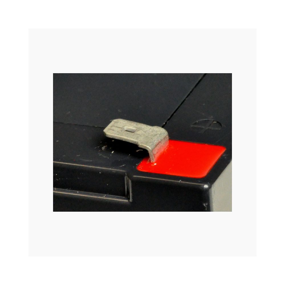 12 Volt 5 Ah Battery for the Kidzone 12V Bumper Car Ride On Toy, close-up view showcasing the compact, rectangular battery with metal terminals on a black surface.