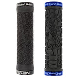 Close-up of the 130 mm Lock-On Moab Grips for Bikes & Scooters, showcasing the raised texture handlebar grip and the black rubber tire with an embossed design.