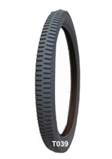 20x2.125 Pneumatic Wheelchair Tire with C713 Tread, featuring an aggressive lug pattern and durable non-marking gray rubber, shown in a close-up view highlighting its tread detail and construction.