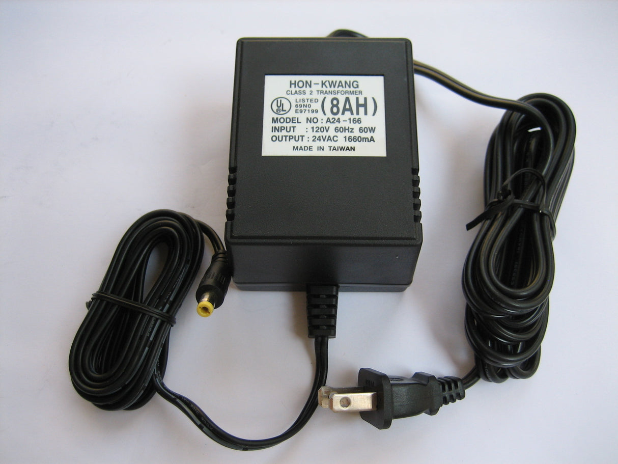 24 Volt 1.6 Amp Coaxial Bladez Battery Charger showing a black power supply with attached wires and a white label, including a wrapped power cord and coaxial connector for Bladez electric scooters.