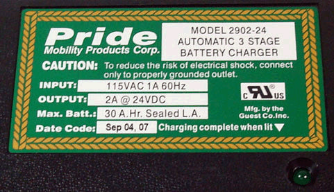 Close-up of the label on a 24 Volt 2.0 Amp Battery Charger for Pride Sonic (SC50) and Dart (SC51) Scooters, showing text and rectangular design elements.