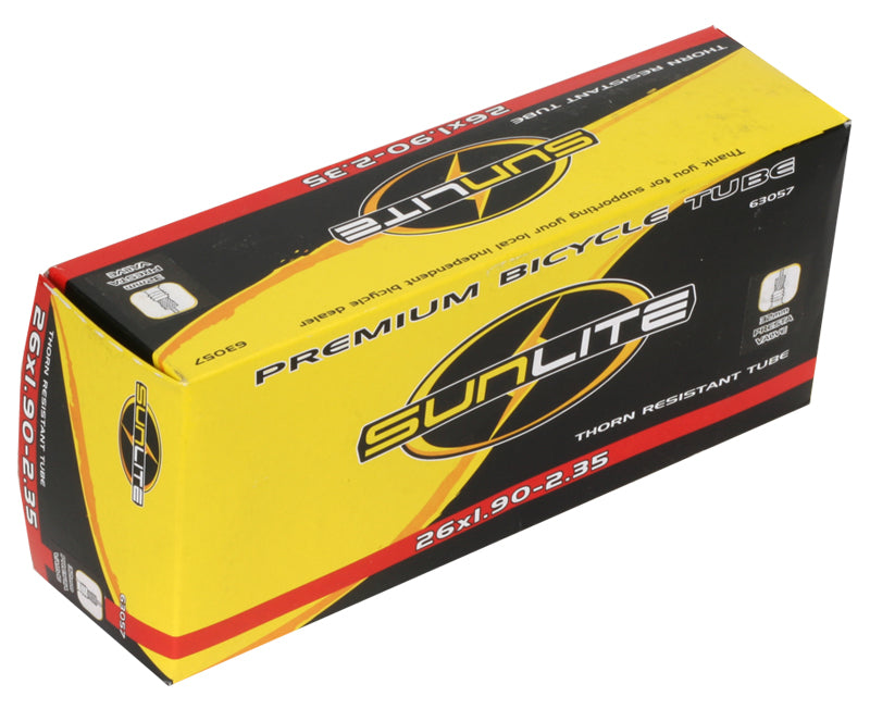 A box containing a 26x1.90-2.35 Heavy Duty Thorn Resistant Bicycle Inner Tube with a 32mm Presta Valve from Sunlite, designed for durability and reliability in bike maintenance.