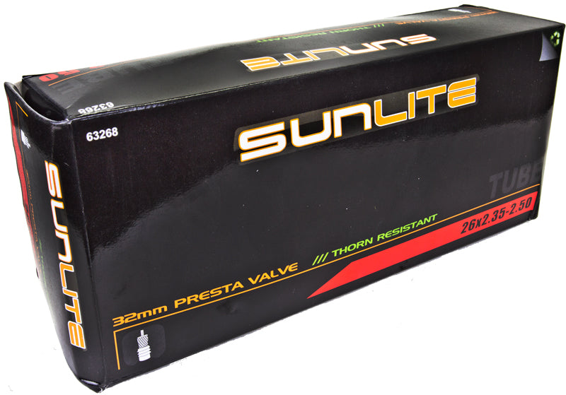 Black box with yellow text containing a 26x2.35-2.50 Heavy Duty Thorn Resistant Bicycle Inner Tube with 32mm Presta Valve from Sunlite, designed for bike parts replacement.