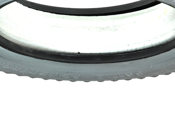 Close-up of Heavy Duty 14x3 (3.00-8) Foam-Filled Mobility Tire (Narrow Lip Profile; 2.375 Bead Width) with Powertrax C248 Tread, showcasing its non-marking gray knobby tread design.