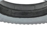 14x3 (3.00-8) Foam-Filled Mobility Tire with Powertrax Knobby Tread for Quickie Scooters, featuring a close-up view of the black rubber tire with detailed tread pattern.