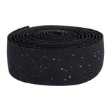 Origin8 Pro Cork Handlebar Tape in black, displayed as a close-up of a rolled fabric-like material, highlighting its grippy texture and adhesive backing for easy wrapping on various bars.